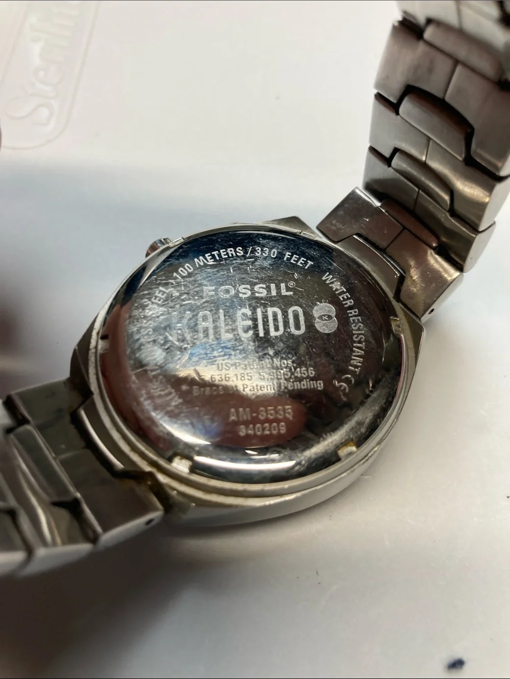 Fossil AM-3535 Kaleido blue and red dial change, stainless, new batteries, tin